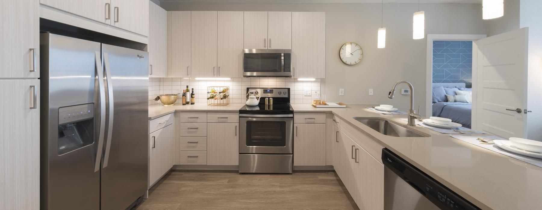 a kitchen with white cabinets